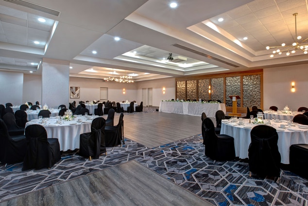 Ballroom with grey and blue floor and gold header