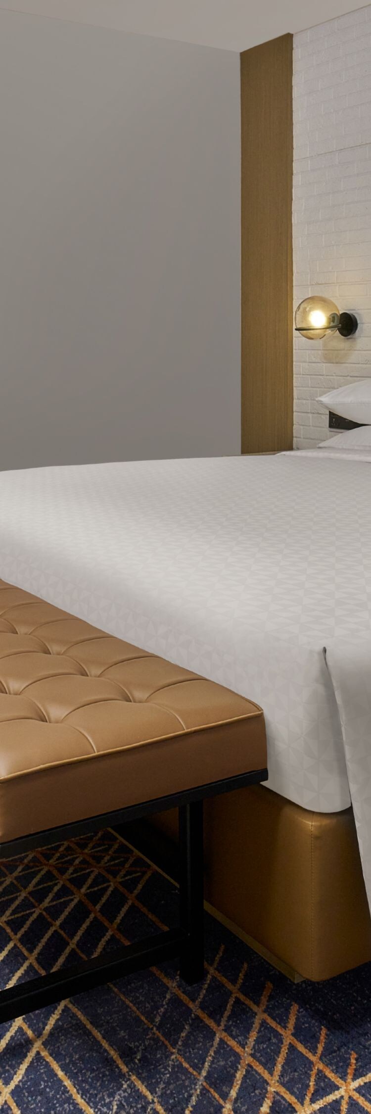 guest room with king bed and bench seating
