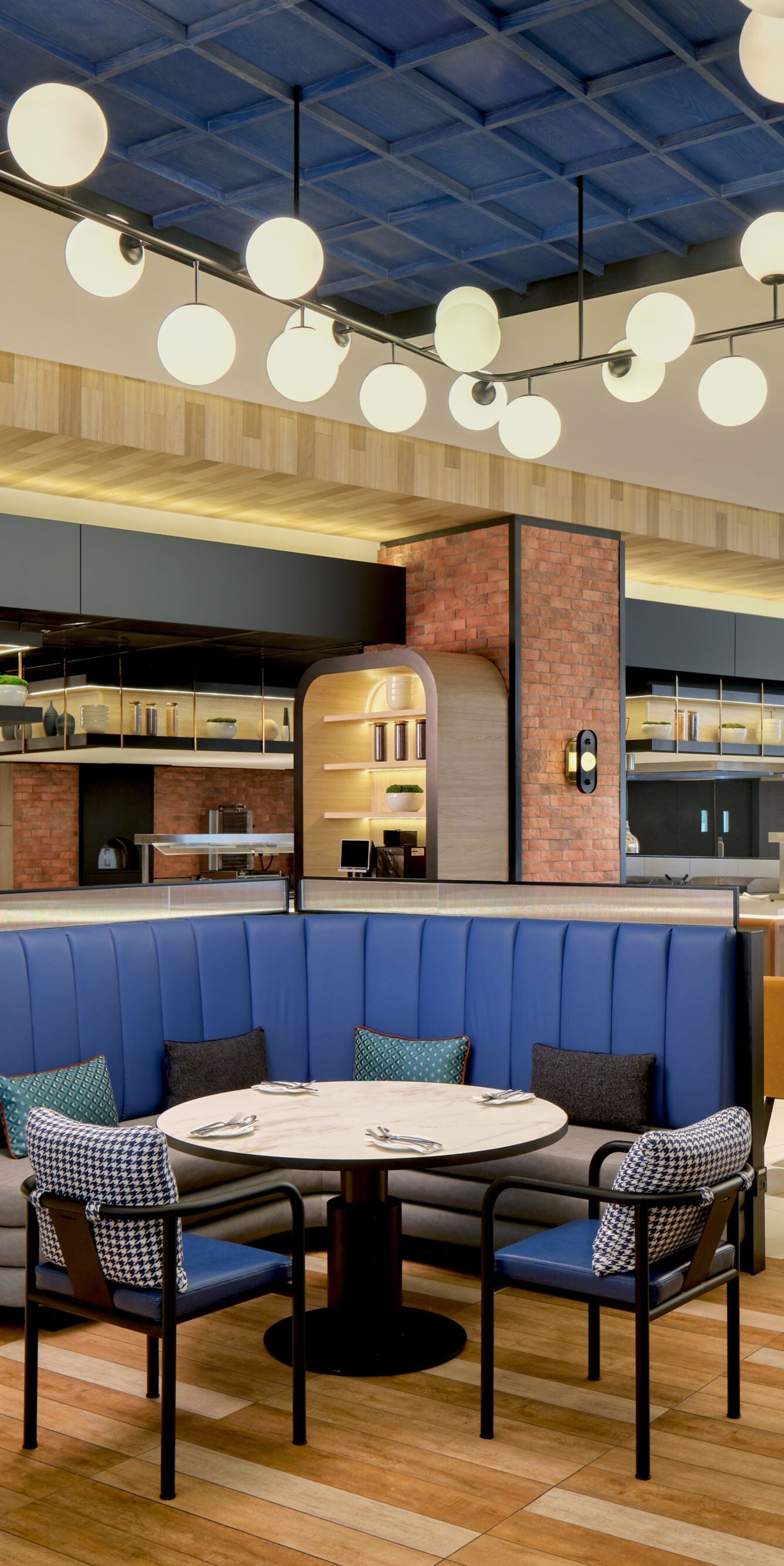 Restaurant with blue booths and lighting