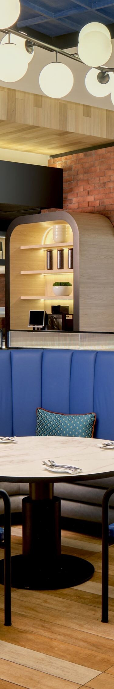 Restaurant with blue booths and lighting