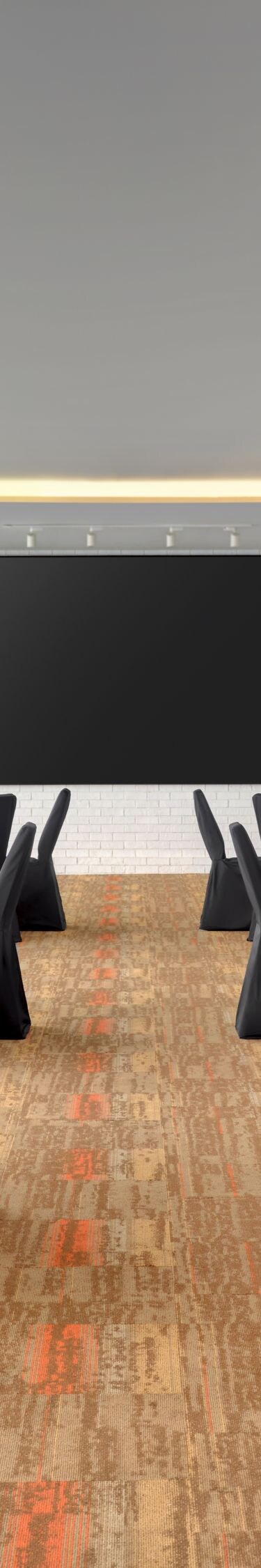 Meeting space with round tables and screen
