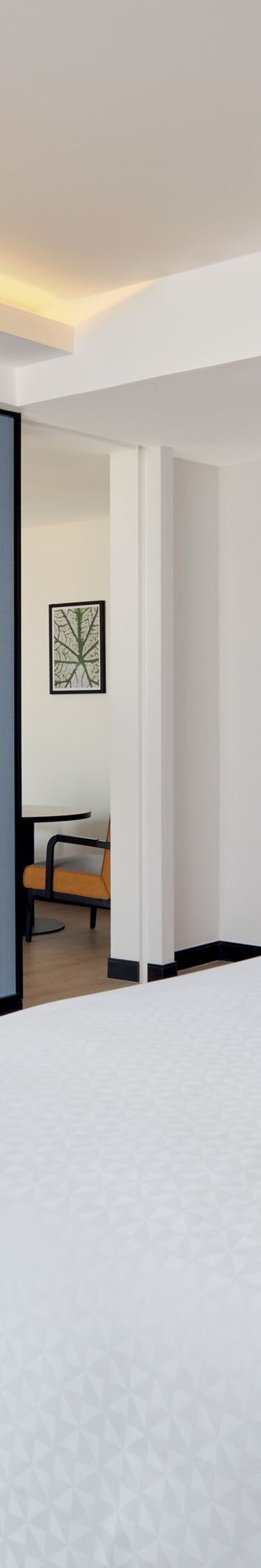 King guest room with desk and blue wall