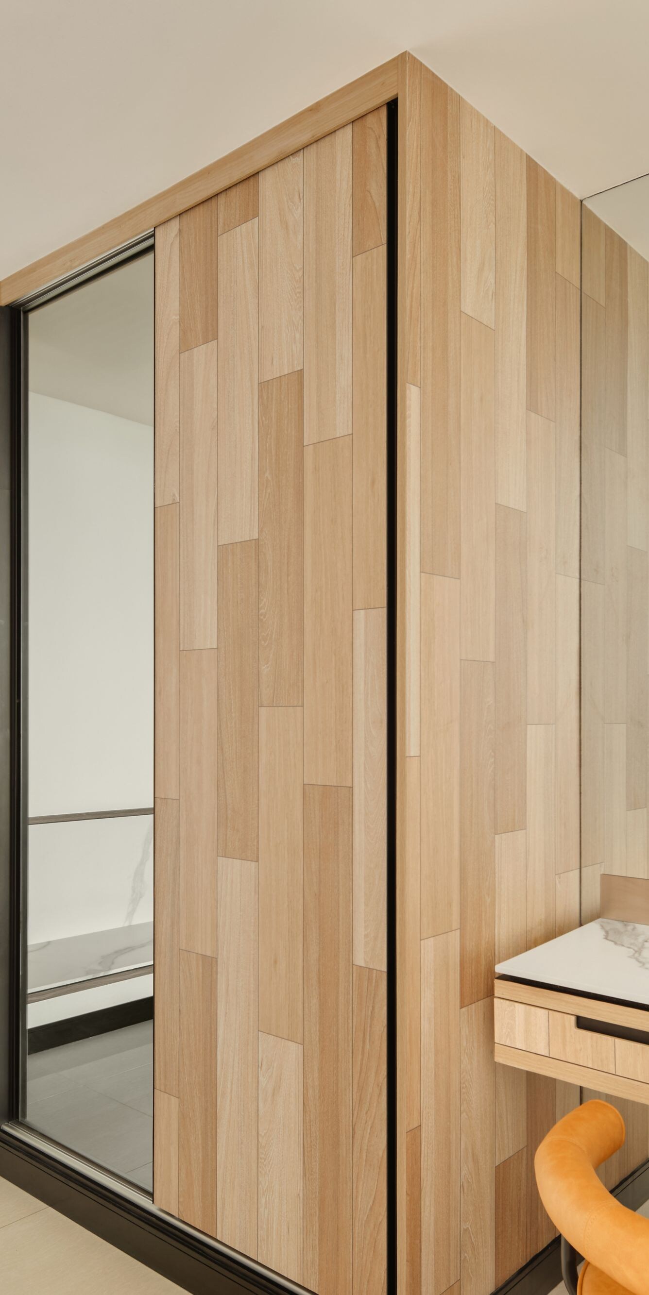 Guest room with marble desk and wood closet