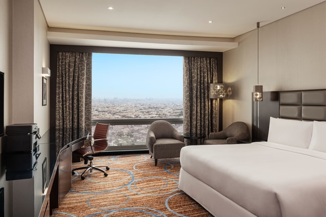 Deluxe Room - Bedroom with City View