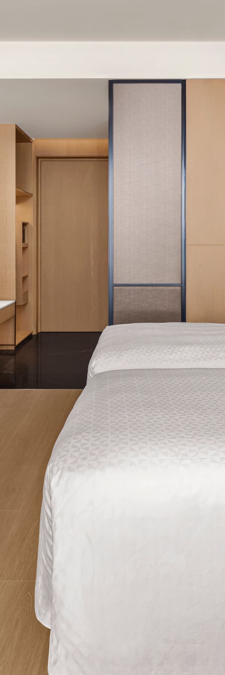 Two double bed guest room with large TV
