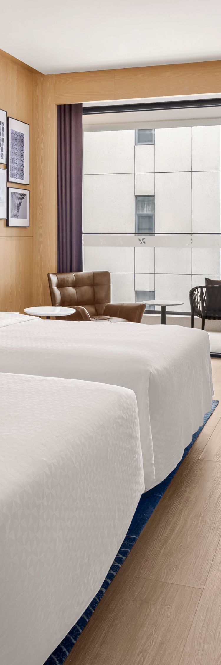 Two double bed guest room with balcony seating