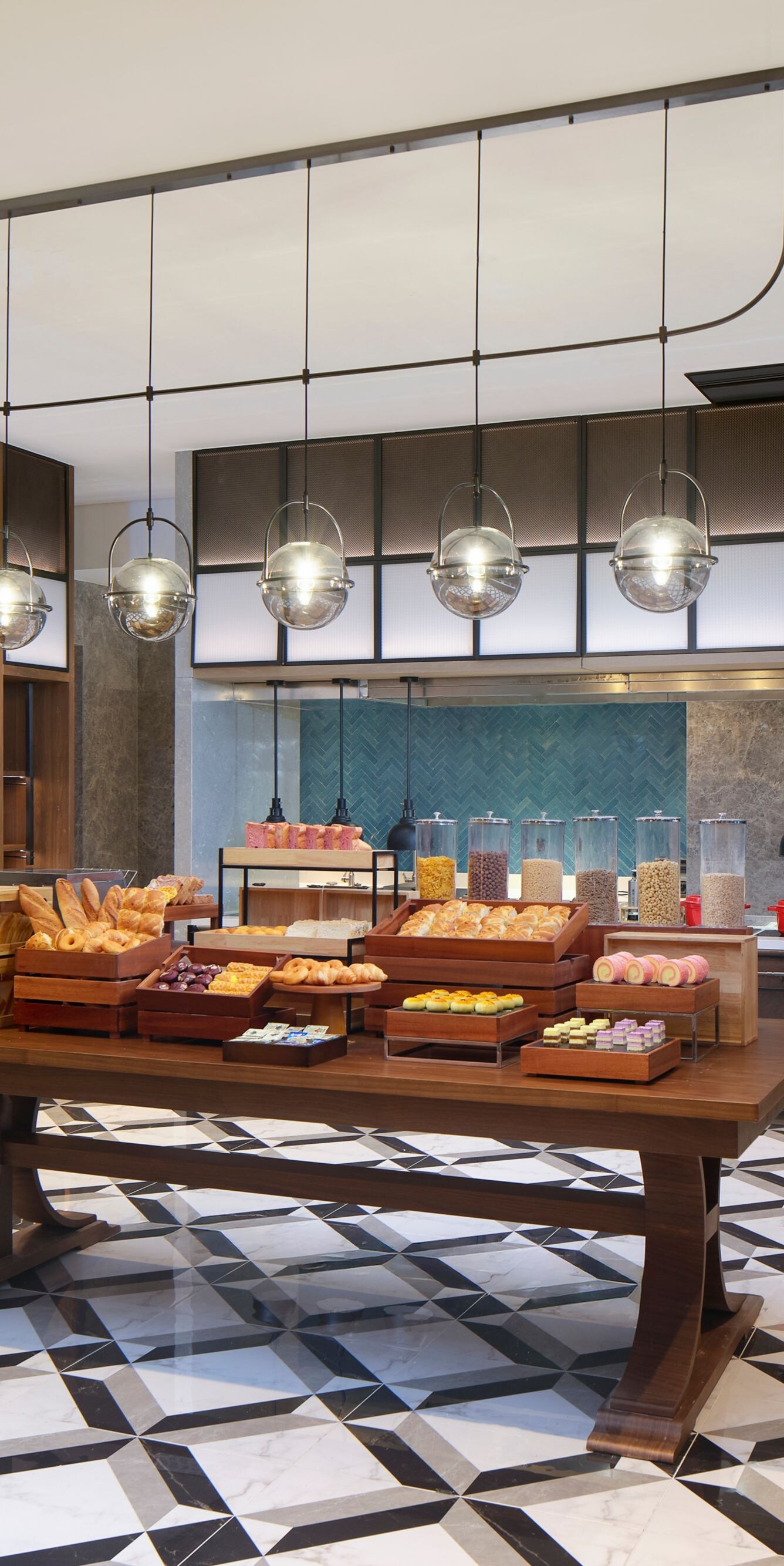 Modern hotel breakfast buffet counter filled with 