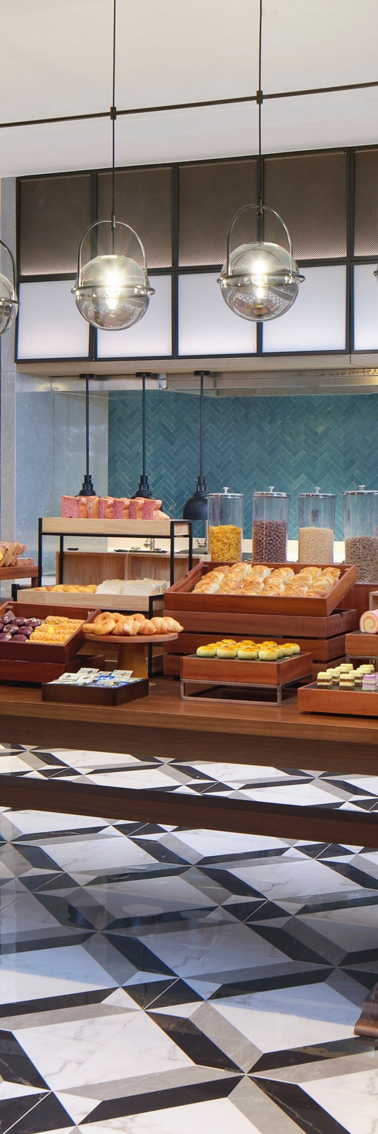 Modern hotel breakfast buffet counter filled with 