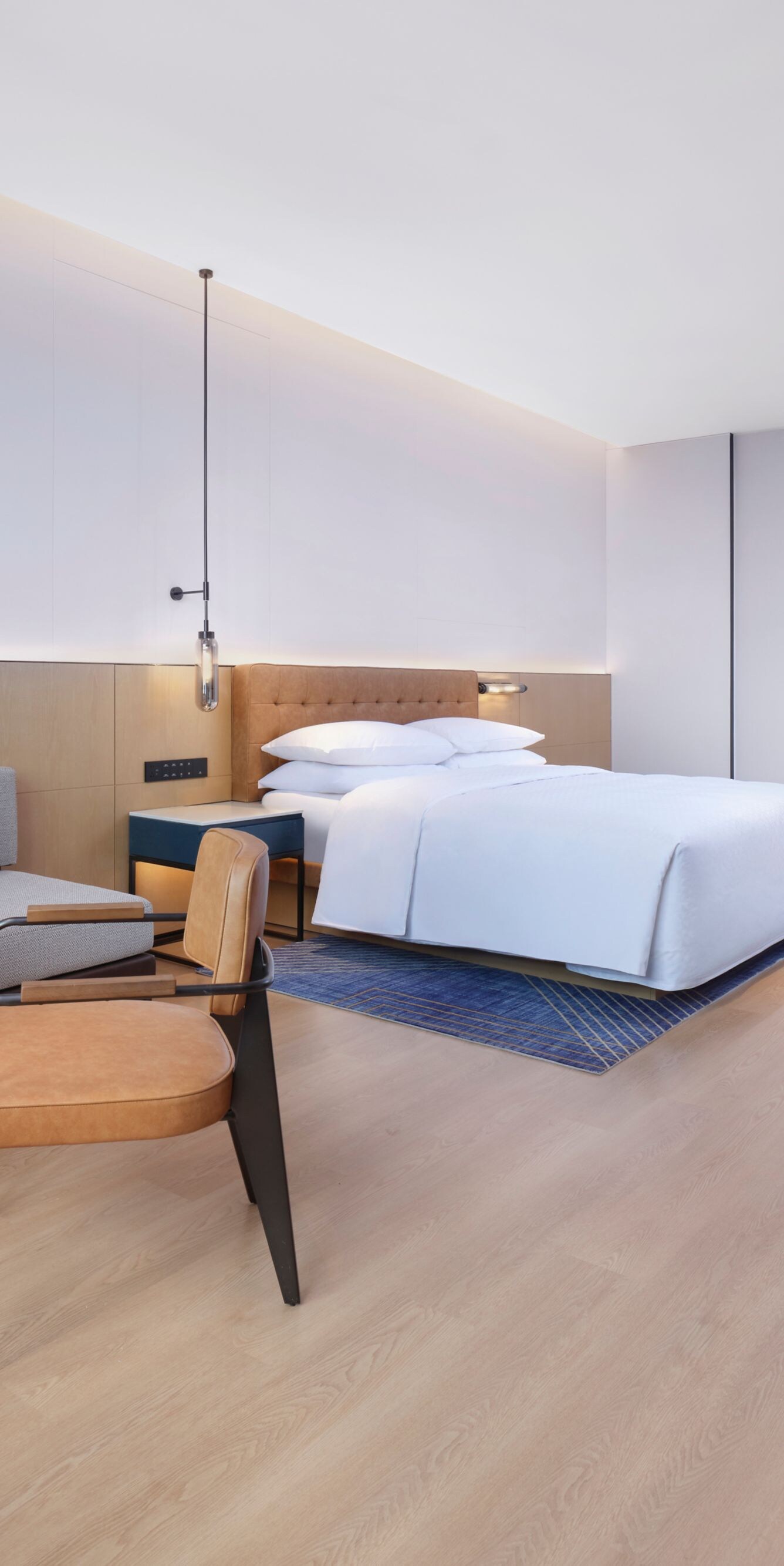 Hotel room with king bed and seating area