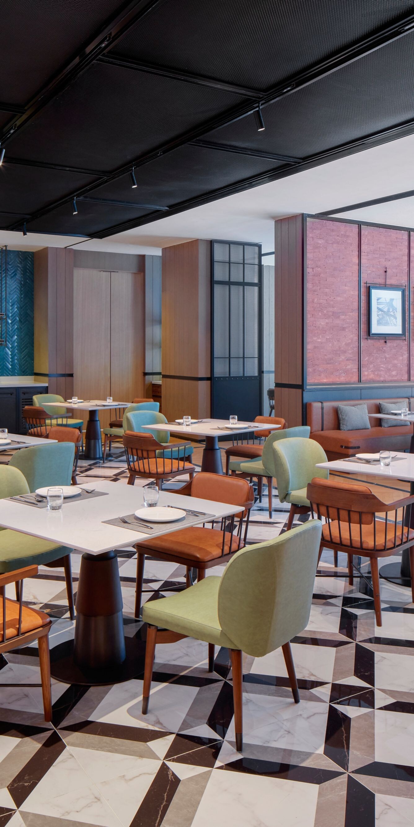 Spacious modern hotel restaurant with neat tables 