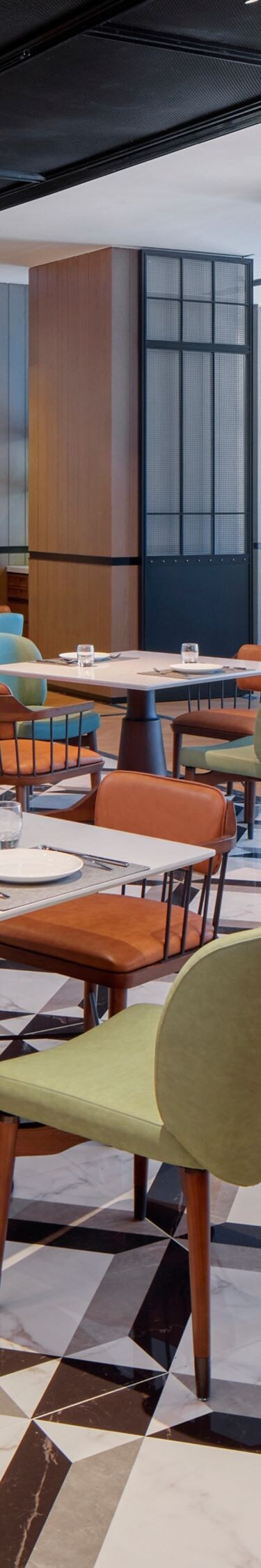 Spacious modern hotel restaurant with neat tables 