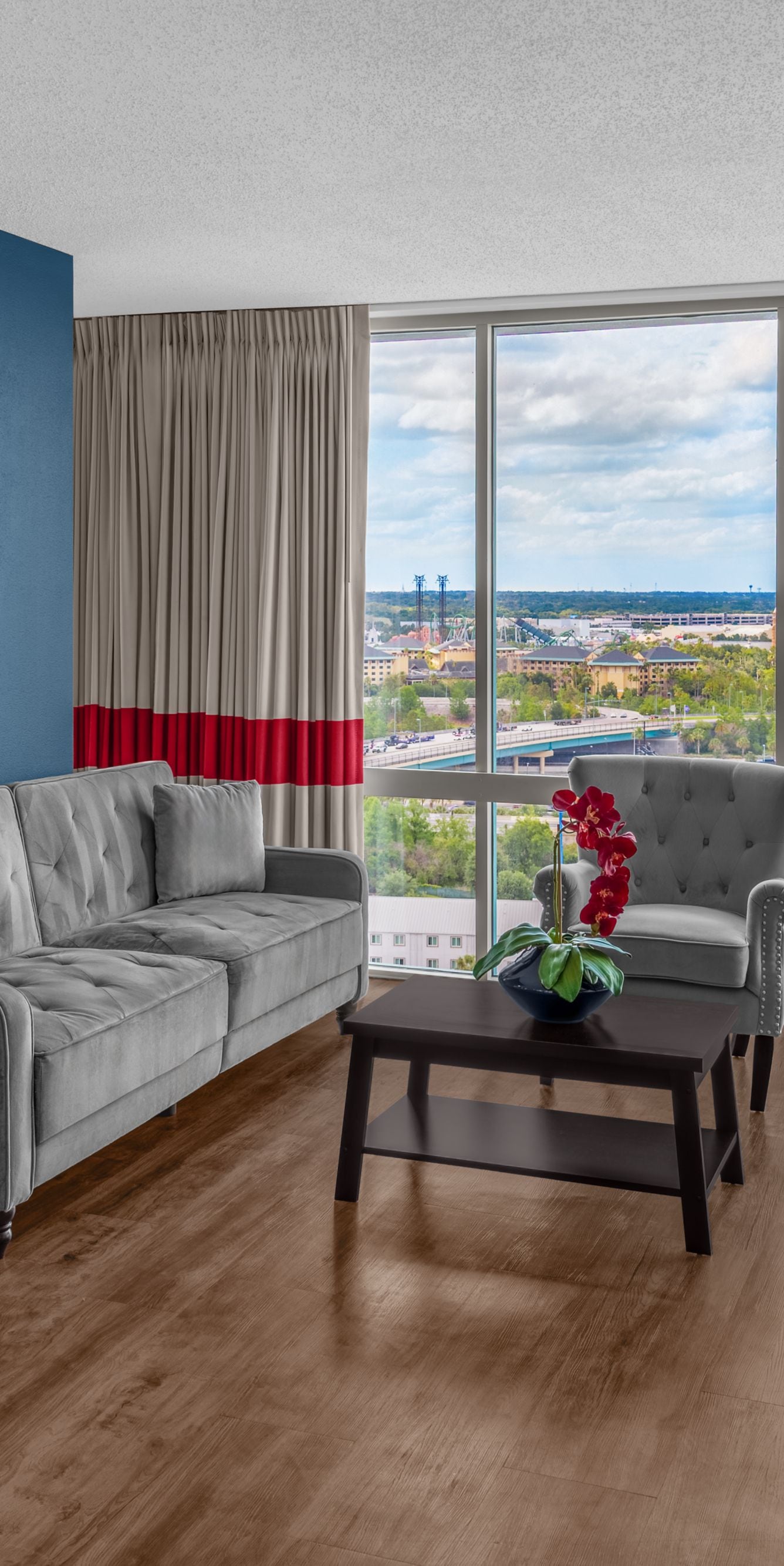 Spacious suite with sofa and city view