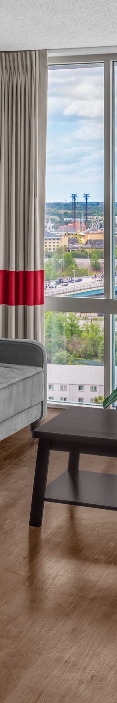 Spacious suite with sofa and city view