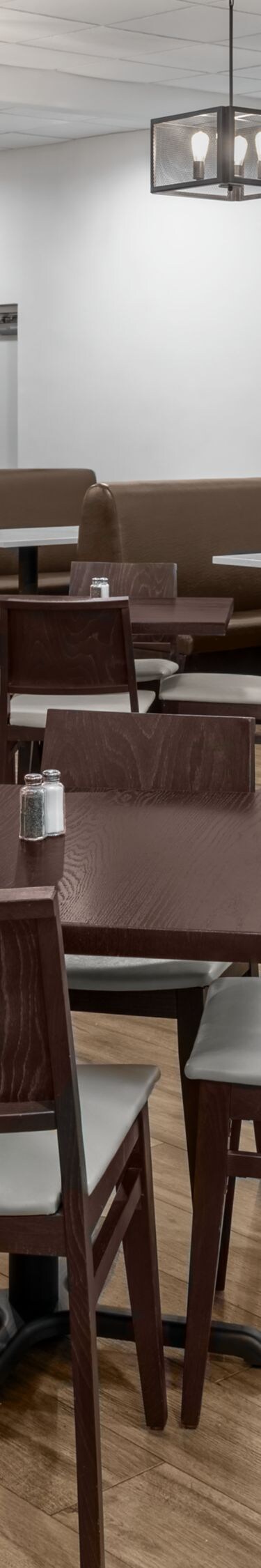 Cafe seating area with tables and chairs