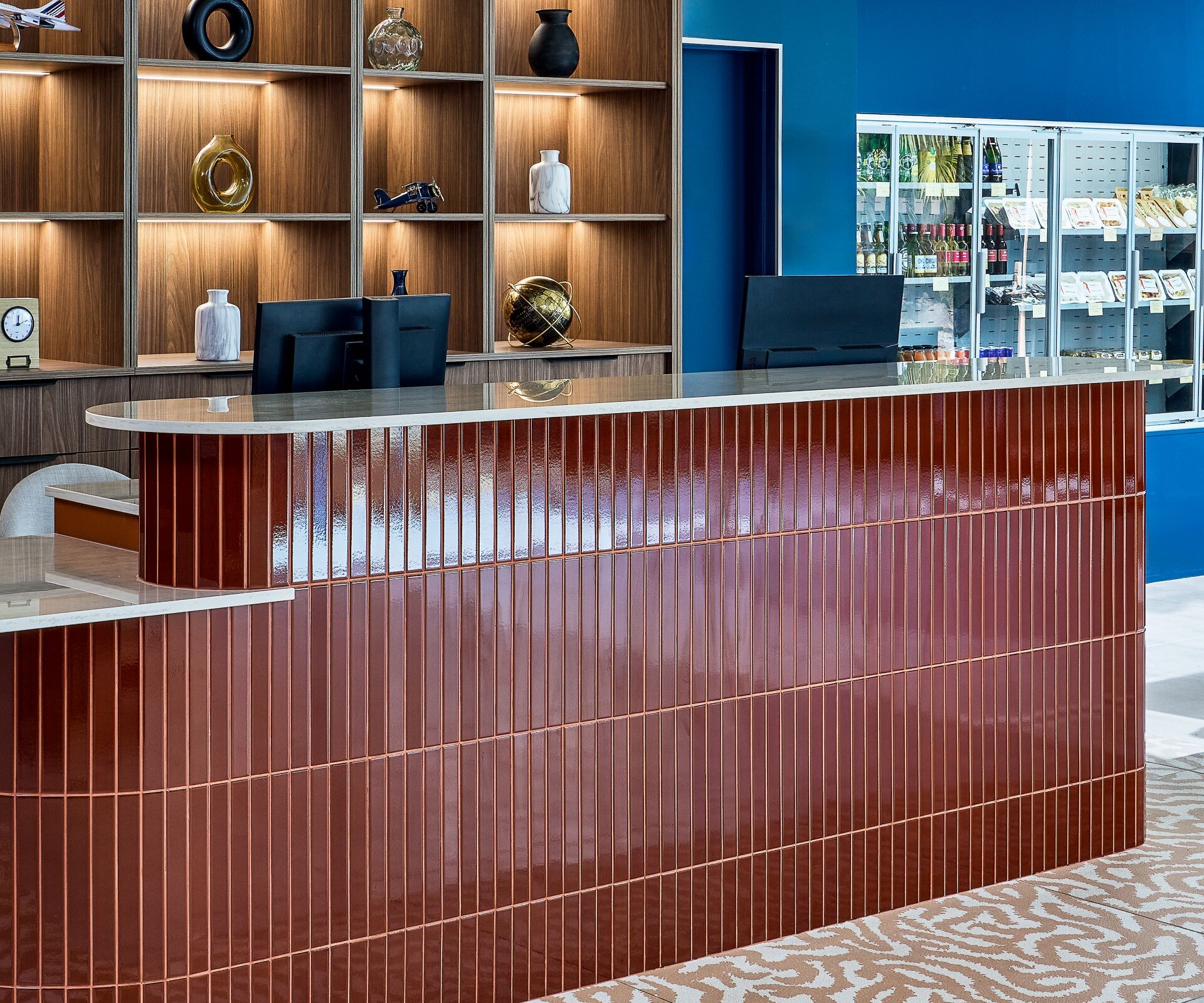 Hotel lobby reception desk with display shelving