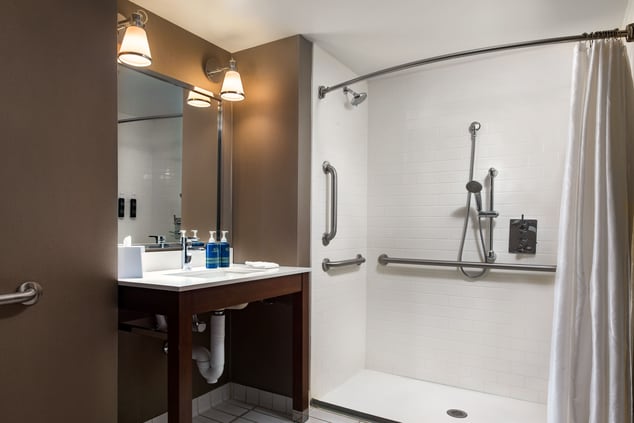 accessible bathroom, roll-in shower, sink