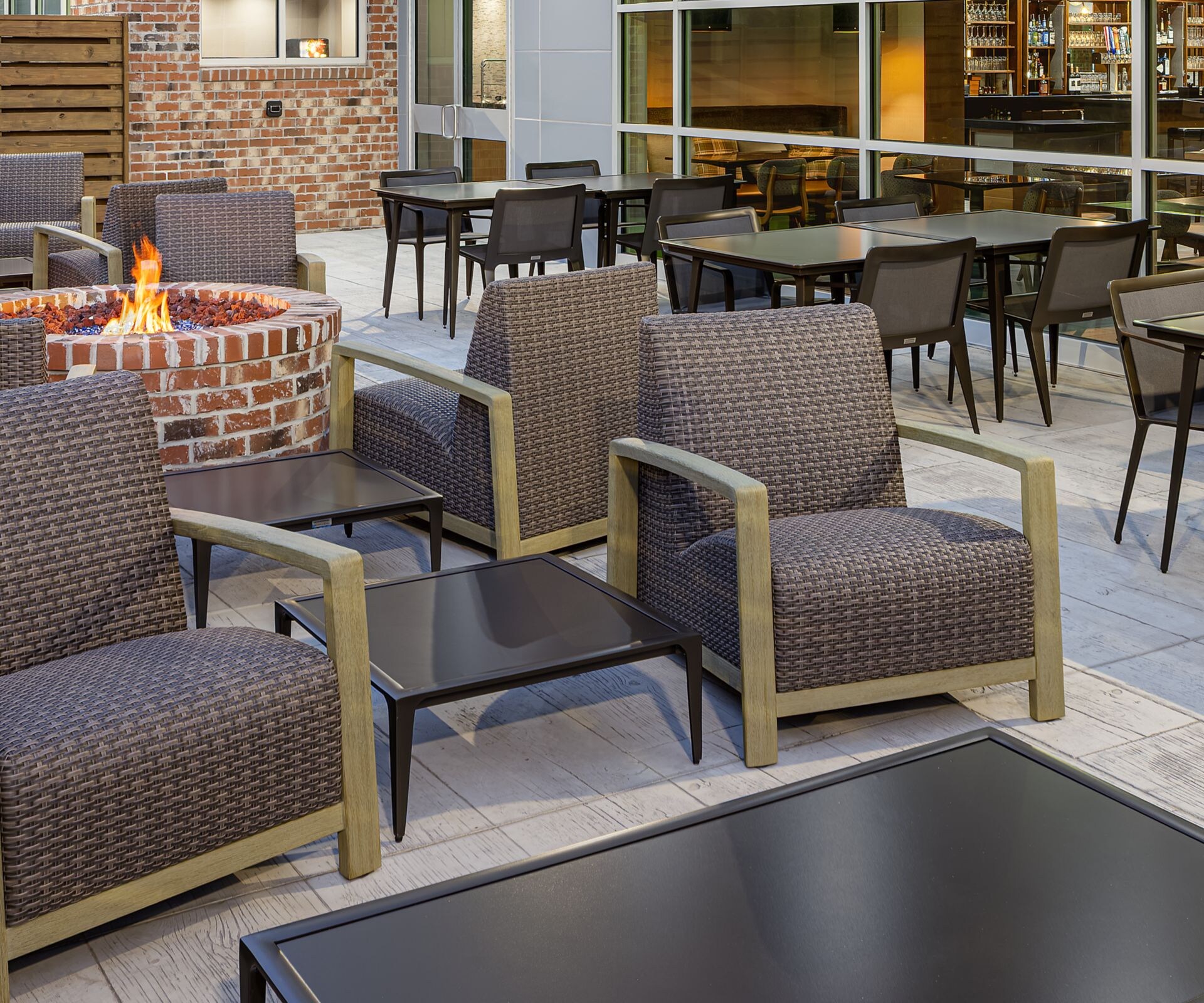 Outdoor patio has a fire pit and plenty of seating
