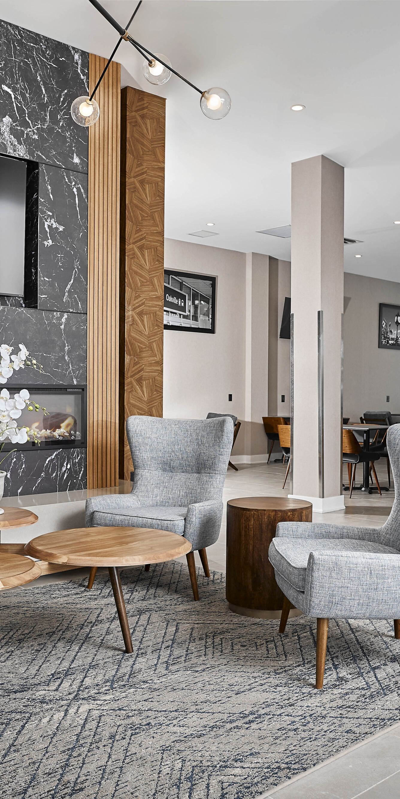 Lobby seating, fireplace, and modern fixtures.