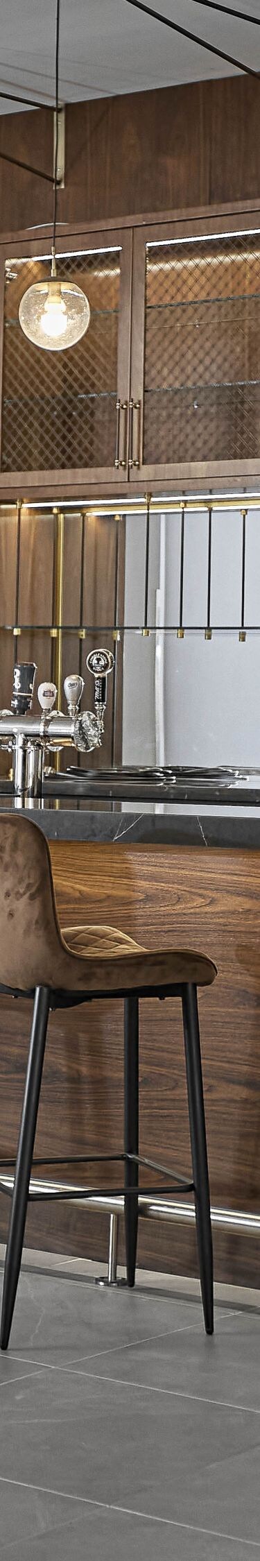 Bar has TVs, bar stools & showcases beer on tap.