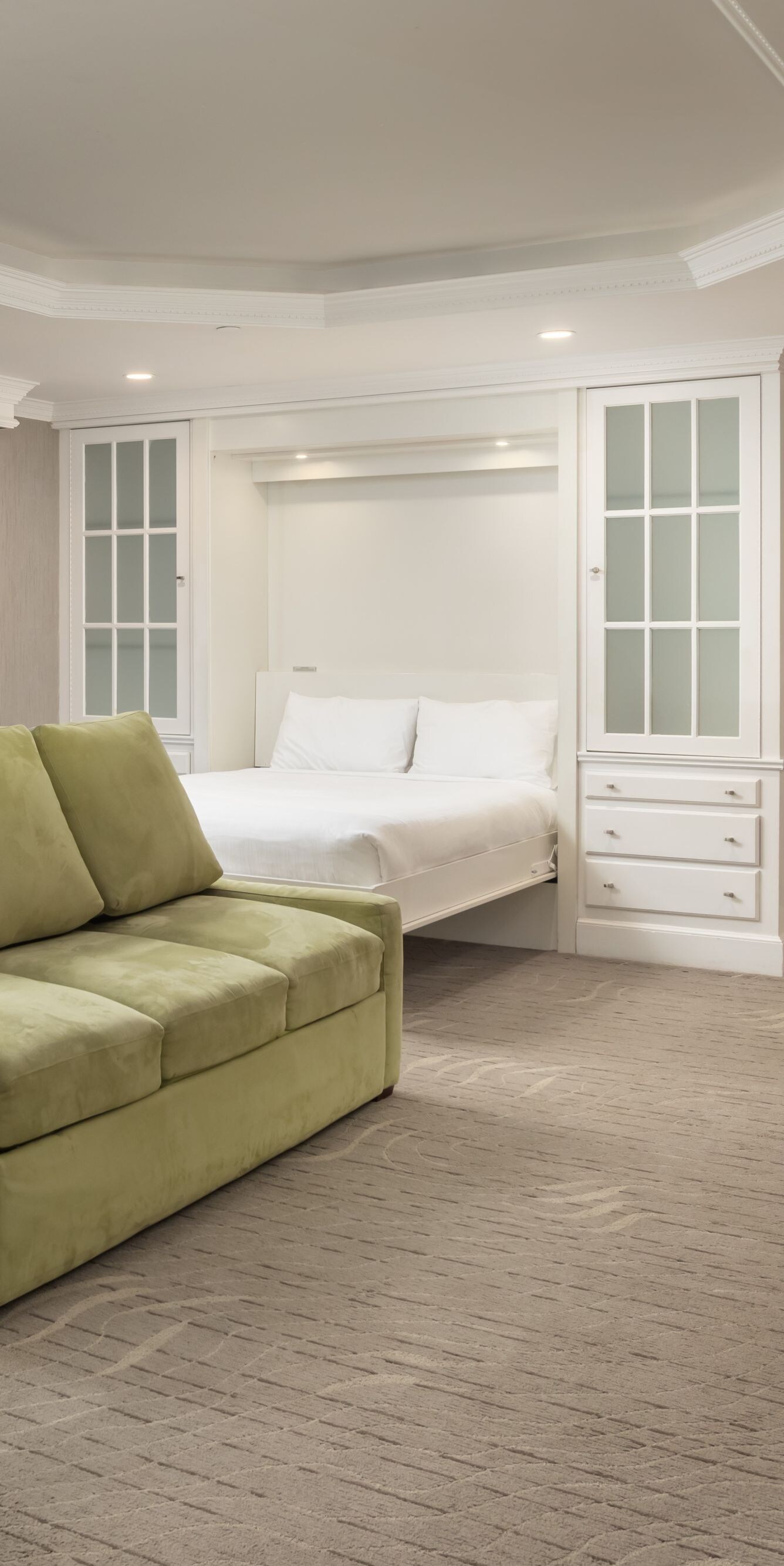 Spacious suite with sofa, desk, and wall bed