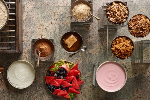 Yogurt and Oatmeal buffet setup with toppings