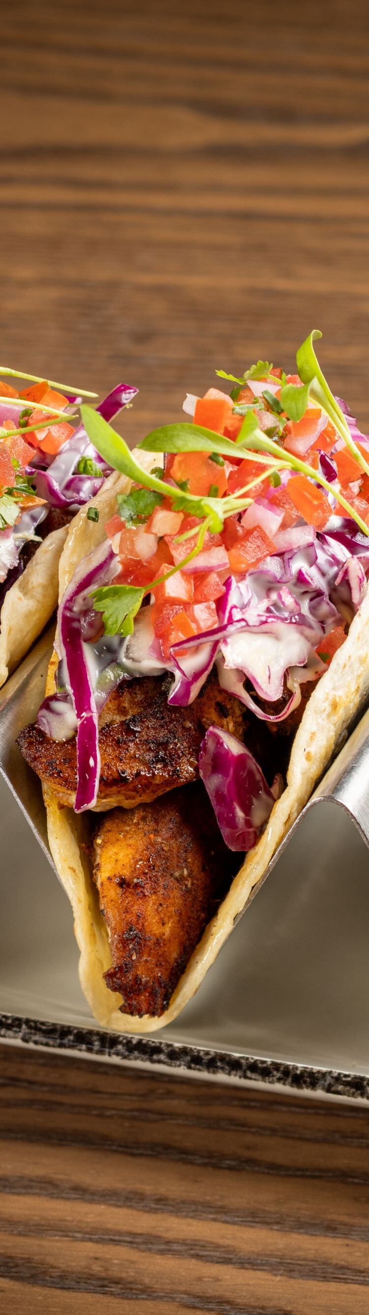 Two grouper tacos with limes and a margarita