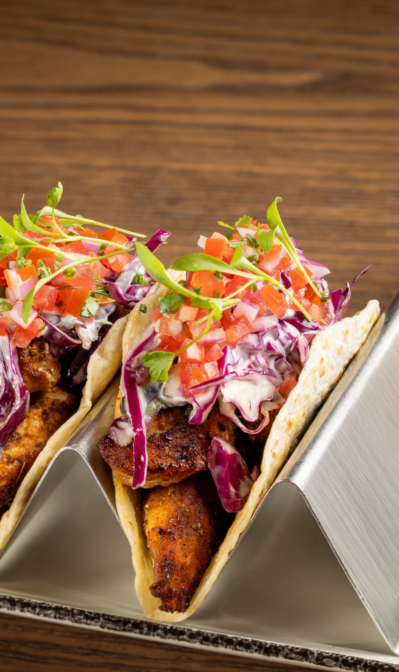 Two grouper tacos with limes and a margarita