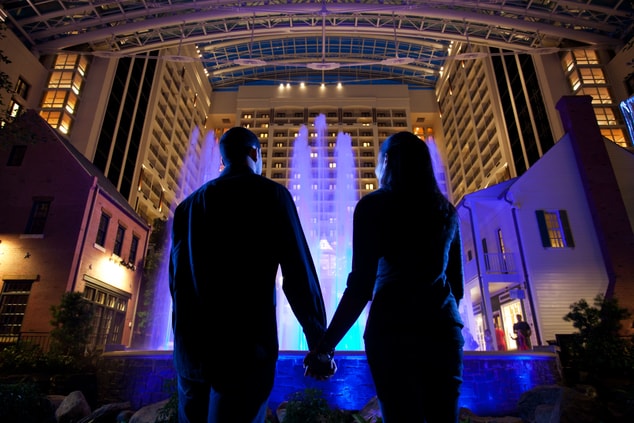 Silhouette couple in front of fountain in atrium