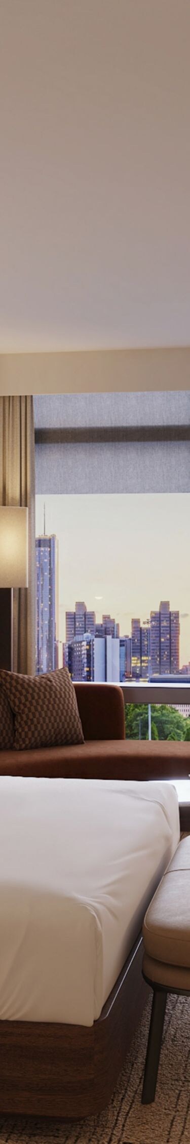 Guest room with king bed and city view