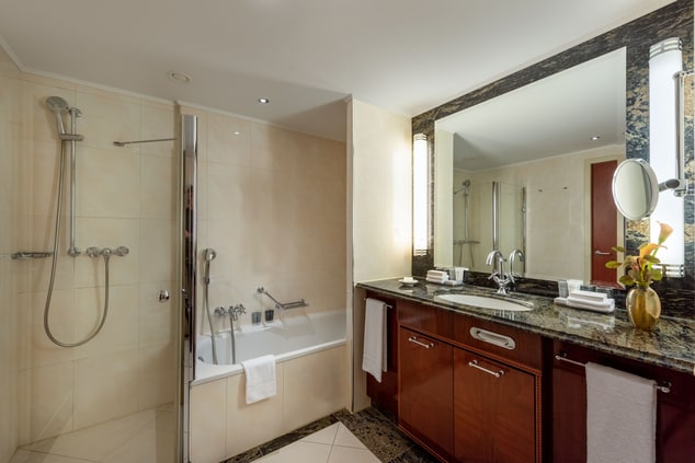 shower, bathtub, two washbasins, amenities