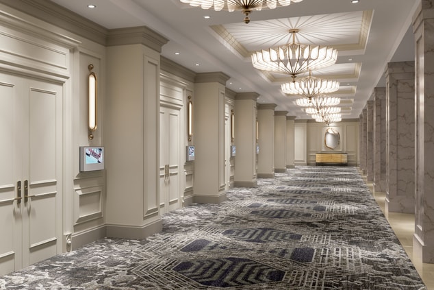 large hallway with chandeliers