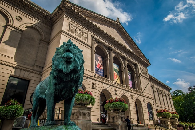 exterior of museum with large lion sculpture