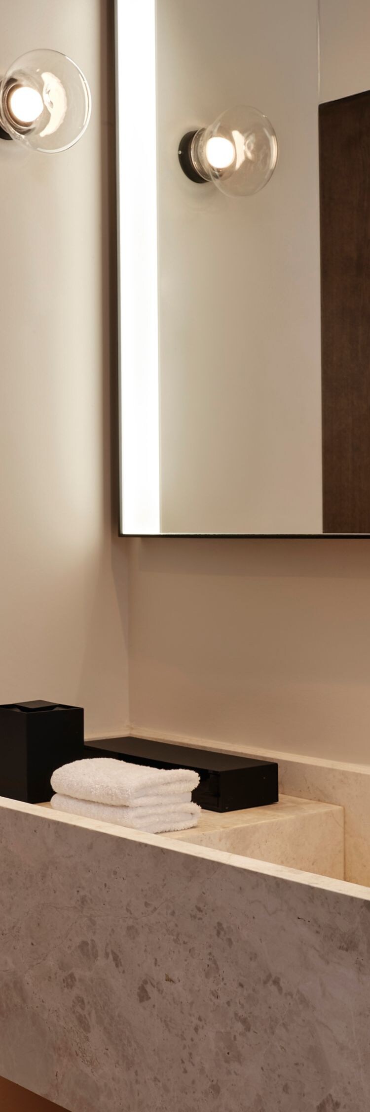 marble vanity, sink, and large mirror