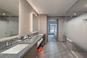 Spacious suite style bathroom with a dual vanity