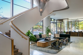 The lobby area with lounge seating and a staircase