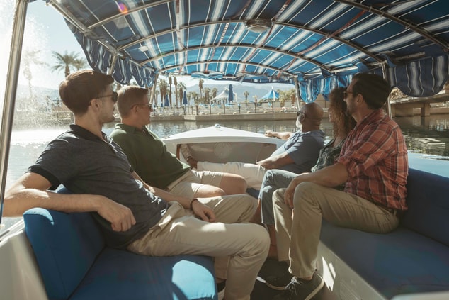 Four people riding in a gondola