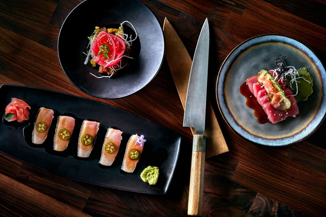 three sashimi dishes and fish knife