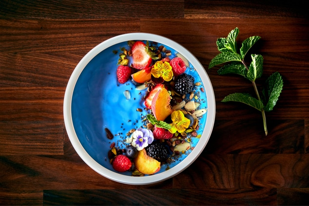 blue yogurt parfait with fresh berries and fruit 