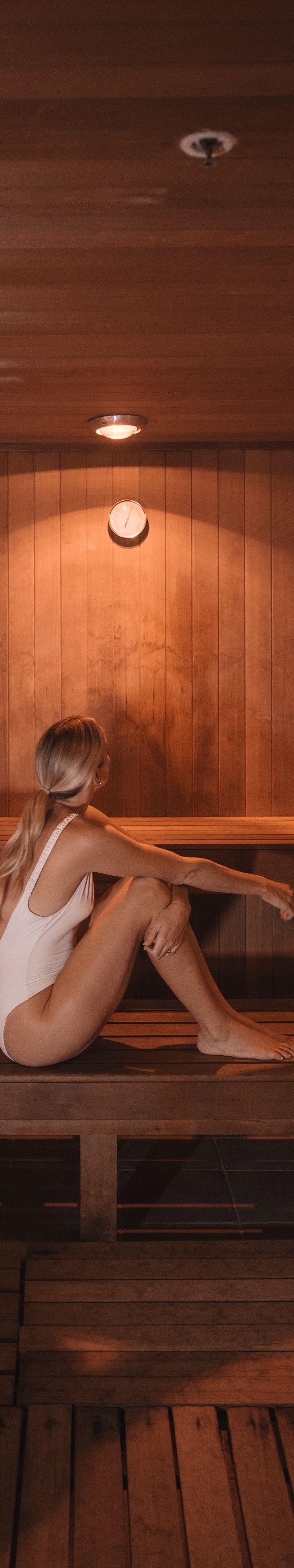 Guest relaxing in the spa sauna at JW Cancun