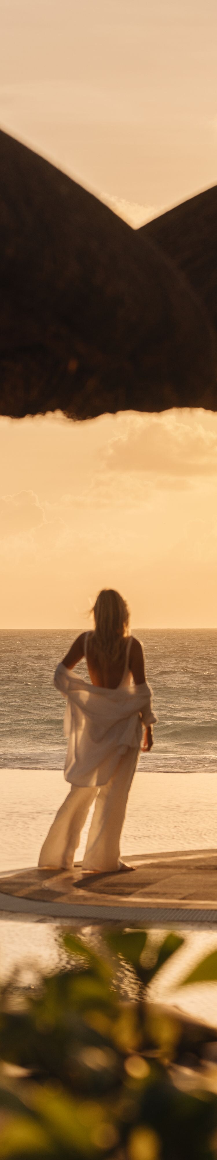 Infinity pool overlooking the Caribbean at sunset