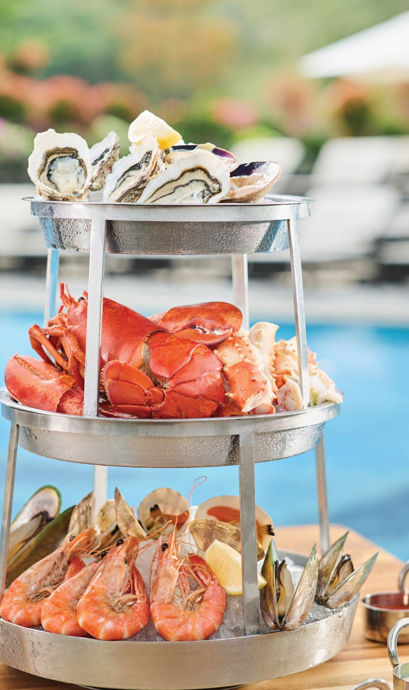 Unwind with fresh seafood by the pool at Fish Bar.