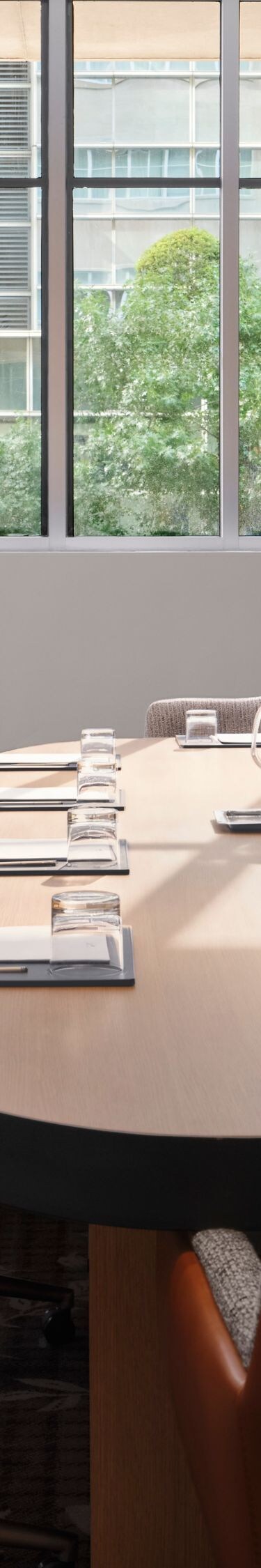 Boardroom with oval table and city view