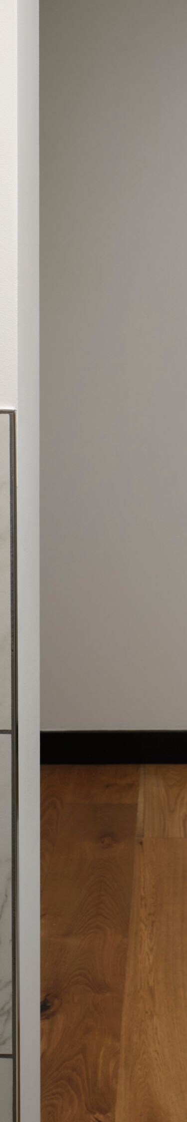 Bathroom with marble vanity and wood closet