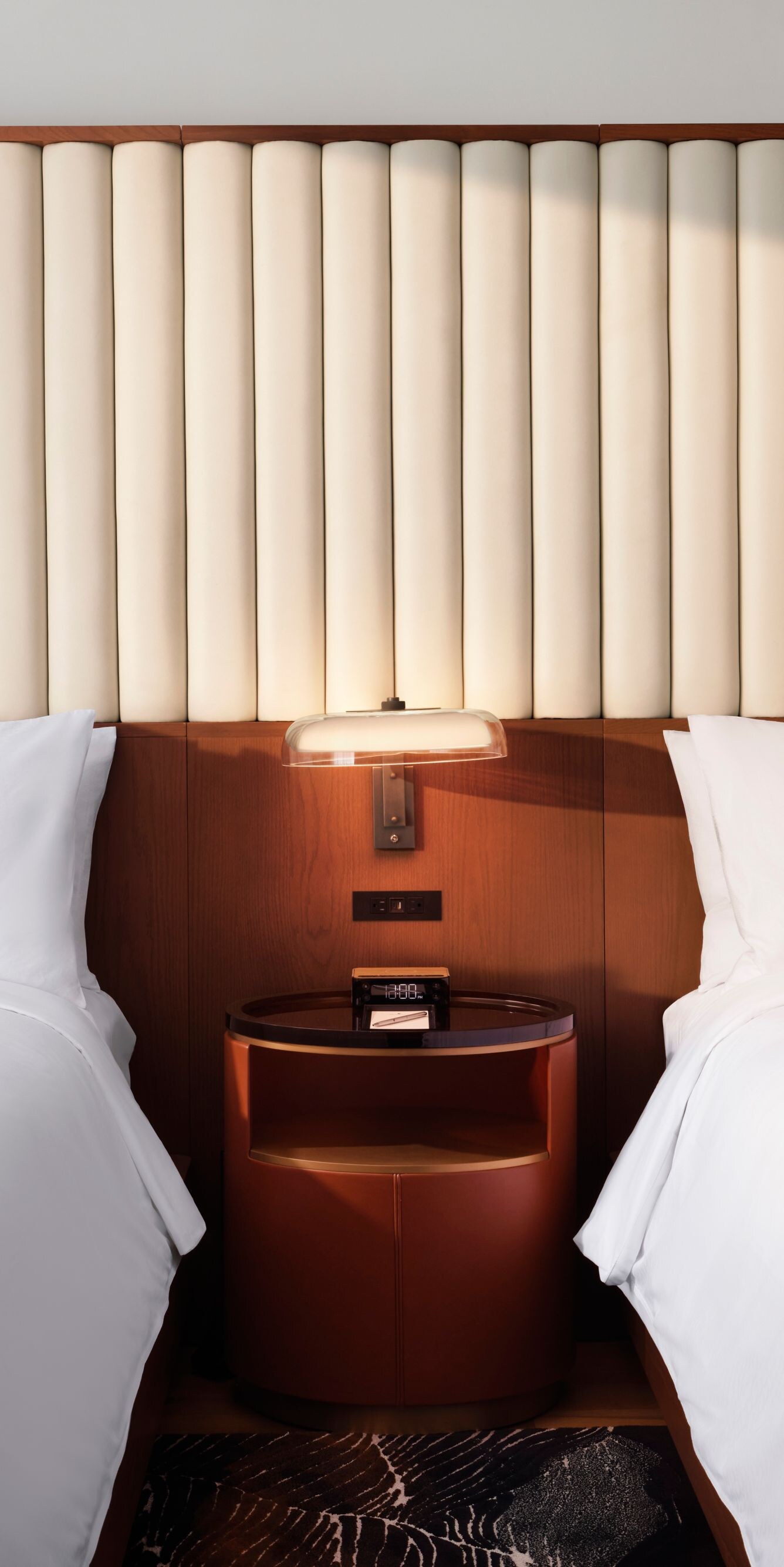 Two queen beds with modern headboard