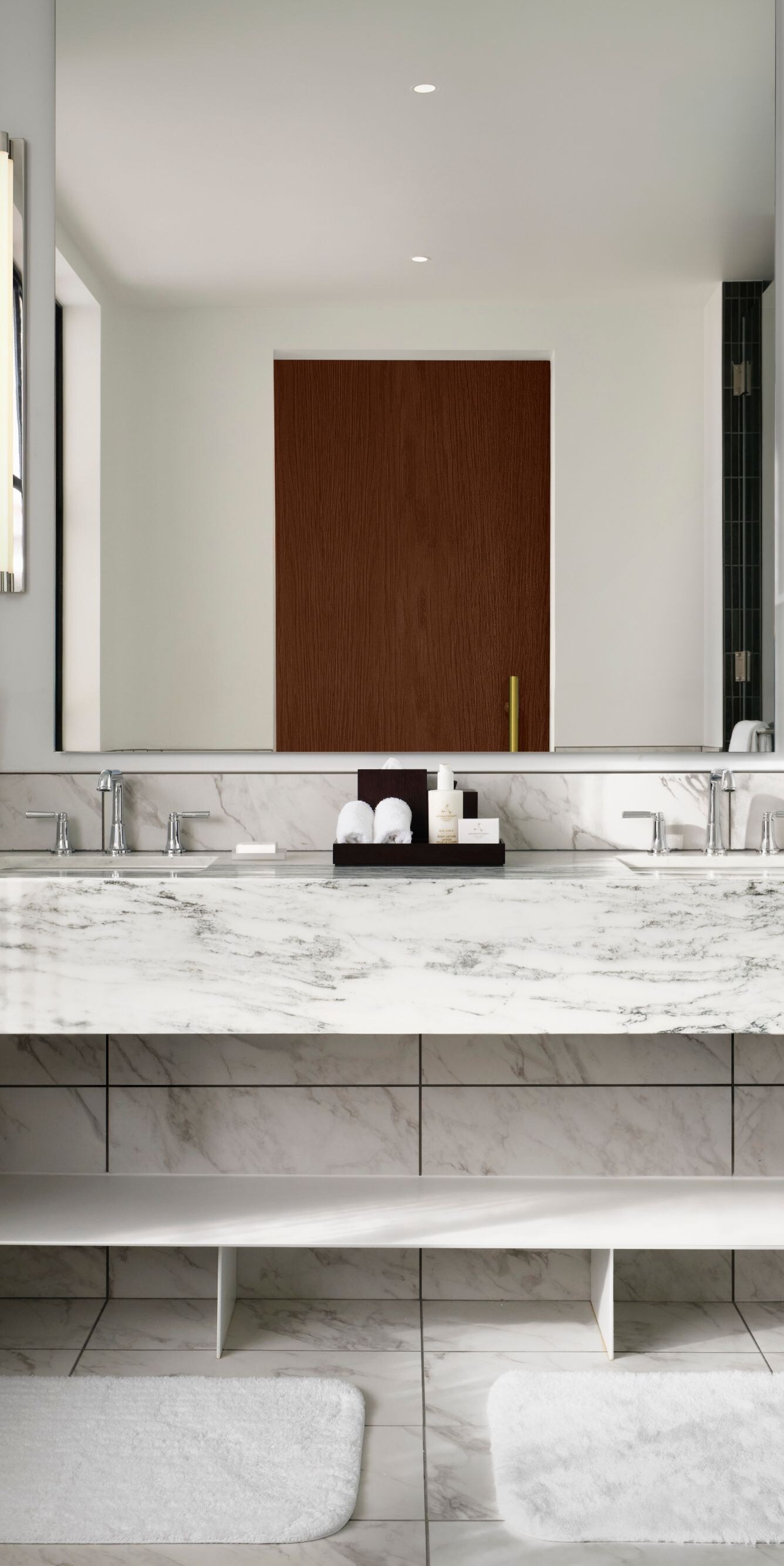 Bathroom with marble vanity and dual sinks