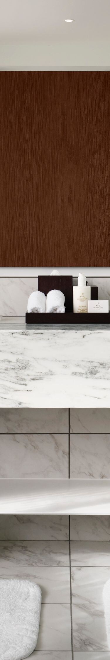 Bathroom with marble vanity and dual sinks