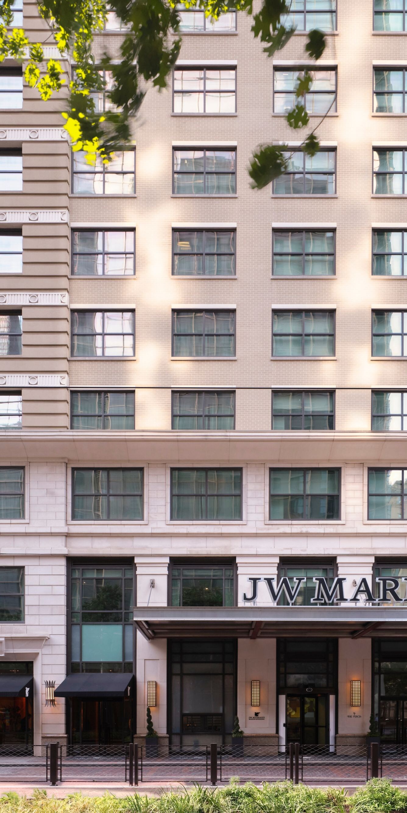 JW Marriott exterior with facade and trees