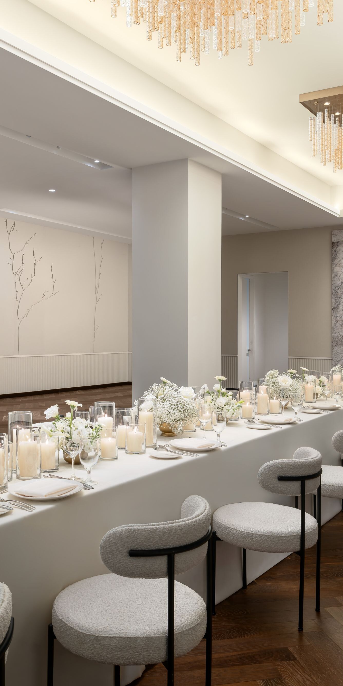 Ballroom with long table and chandeliers