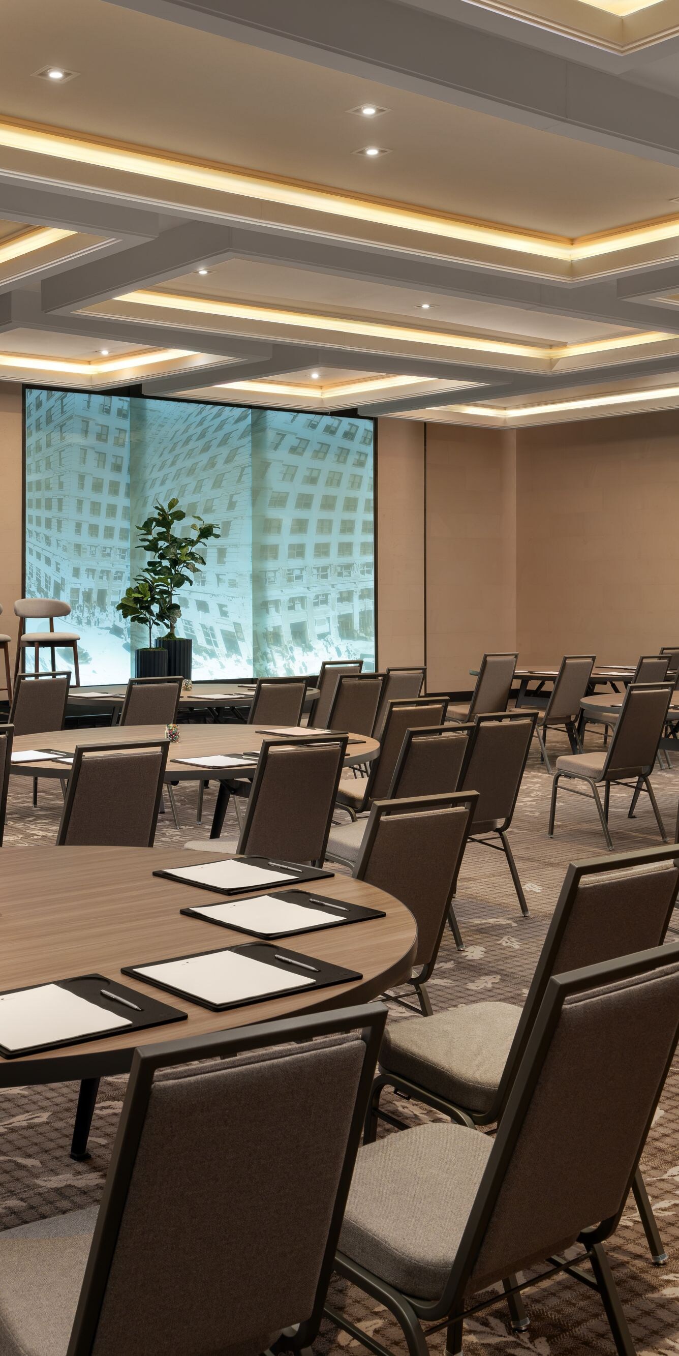 meeting room with round tables and city views