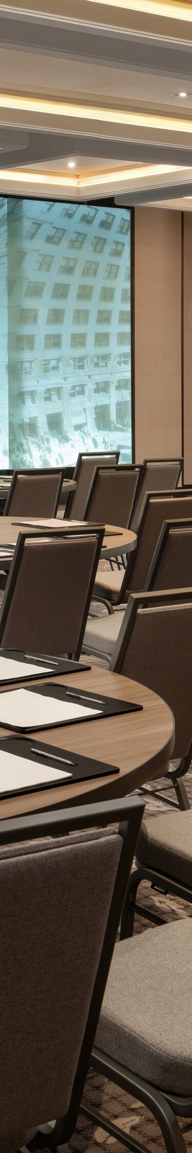 meeting room with round tables and city views